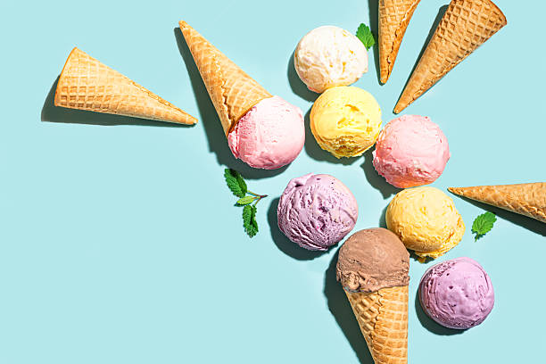 istock Ice cream scoops and waffle cones creative flat lay 2216306920