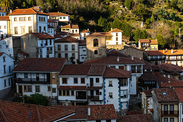 istock Sunlit Hillside Village. Lastres, Asturias 2216309392