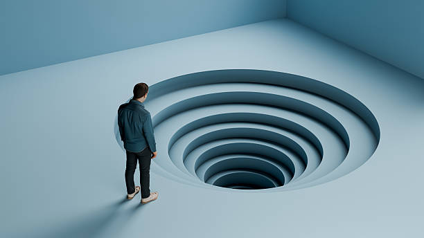 終わりなき下降スパイラルの上に立つ男 - 借金、絶望、そして逃れられないサイクルの概念、3dレンダリング - 繰り返し ストックフォトと画像