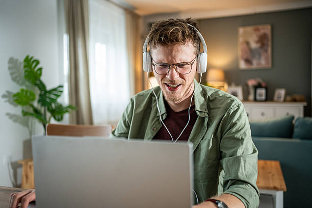 istock Frustrated young adult man working on laptop 2216313772