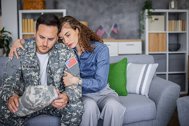 istock Soldier feeling stressed, getting support from his wife 2216318257