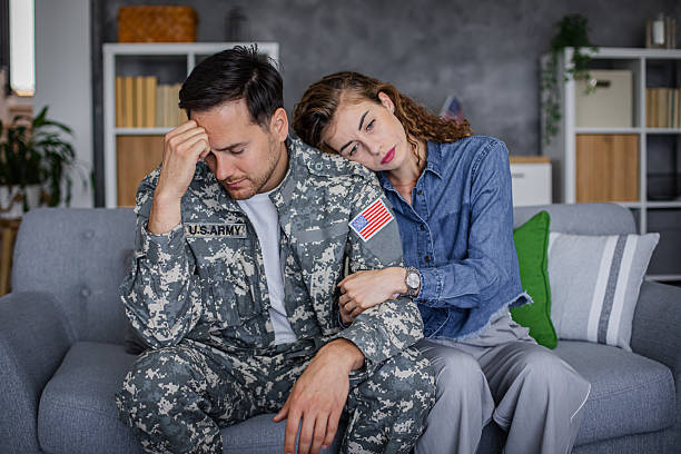istock Soldier feeling stressed, getting support from his wife 2216318312
