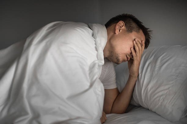 istock Man in bed cannot sleep. Sleep apnea, insomnia. 2216318926