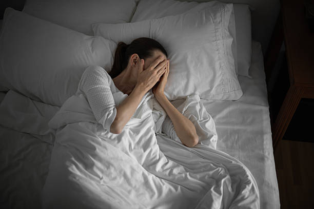 istock Woman suffering from insomnia in the bed. 2216319041