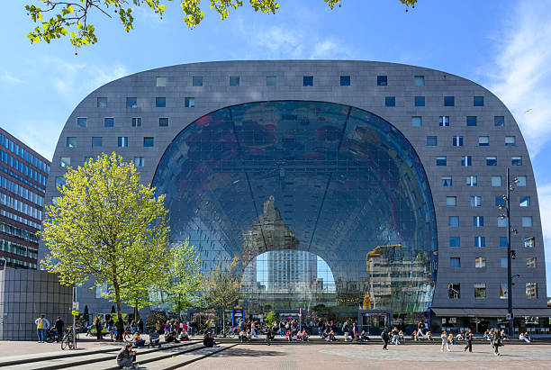 Rotterdam, the Netherlands - April 18, 2025 :  The Market Hall, the city's iconic architectural landmark, under blue sky.