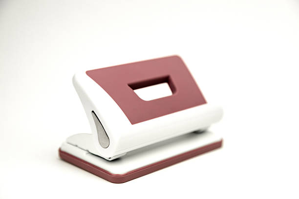 Hole punch: stationery. Hole punch on white background close-up. High quality photo