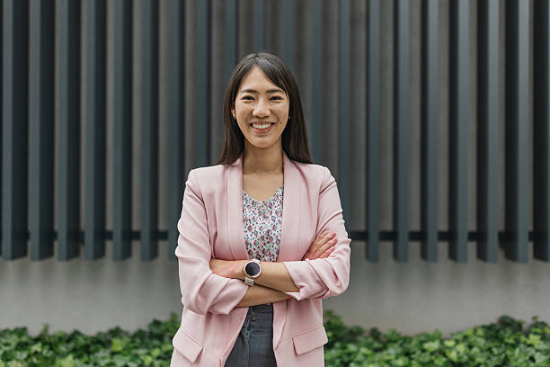 istock Confident woman poses proudly against modern backdrop 2216327303