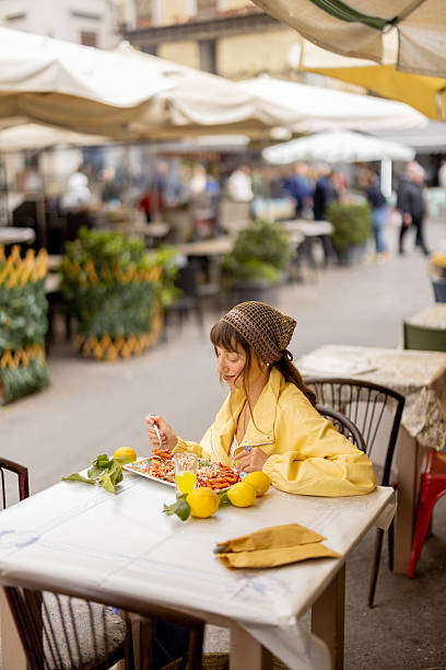 istock Happy woman enjoying Sicilian pasta 2216327746