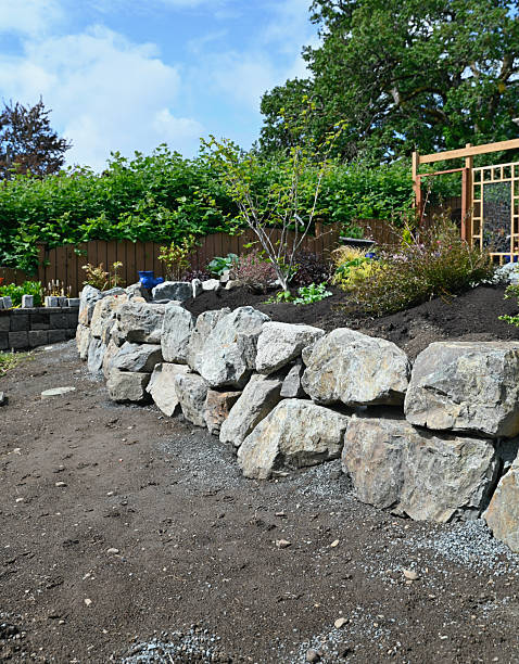 istock Building home garden stacked stone retaining wall for border gardens 2216328442