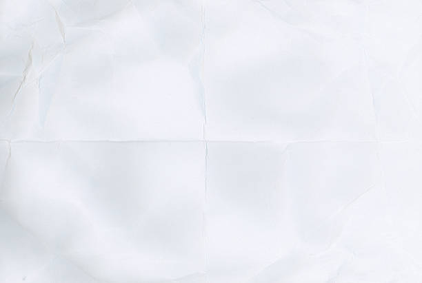 Photo of crumpled paper in the shape of a smiling woman in a hat