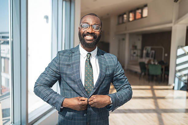 istock Professional businessman smiling confidently in a modern well-lit office environment 2216331161