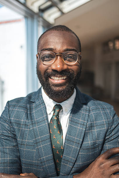 istock Confident business professional smiling in a bright, sunlit professional office setting 2216331192