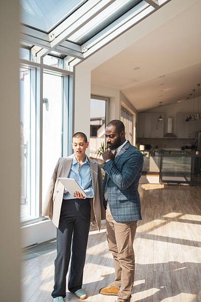 istock Business professionals discussing plans in a bright modern office space 2216331224