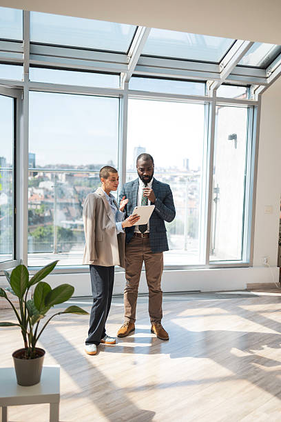 istock Business professionals discussing in a bright modern office space 2216331229