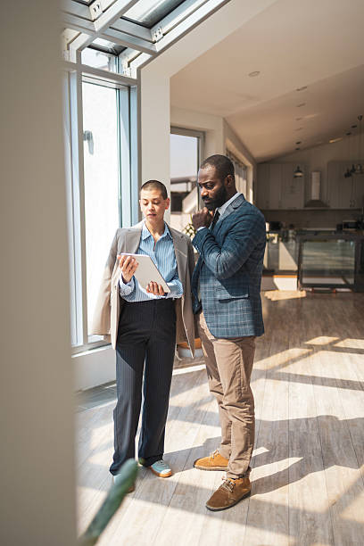 istock Two professionals discussing business ideas in a modern sunlit office space 2216331234