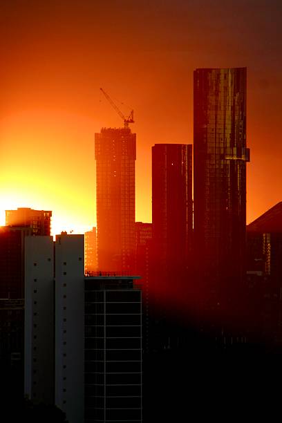 istock sun rays coming from behind the towers on St Kilda road, Melbourne 2216332033