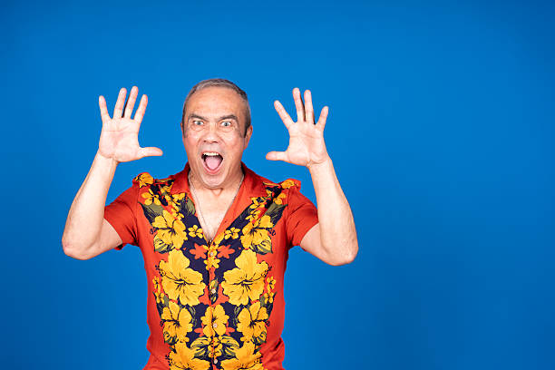 istock Surprised senior man shouting with open hands on blue background 2216332143