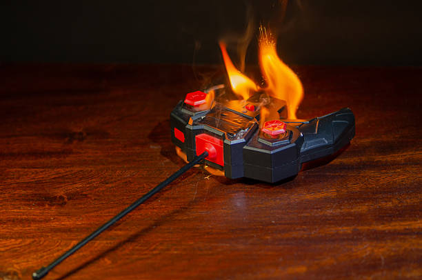 Danger of toy electronics: burning remote control. The plastic remote control of a child's car is engulfed in flames