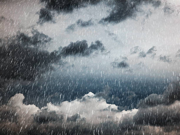 istock Dramatic stormy skyscape with heavy rainfall against dark threatening clouds 2216333999