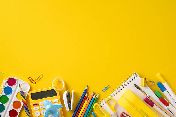 istock Colorful school and art supplies placed on a yellow surface, symbolizing creativity, learning, and preparation 2216334990