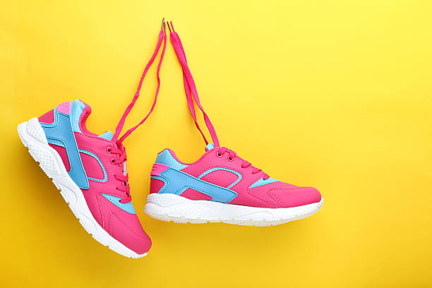 istock Sport shoes on yellow background 2216335229