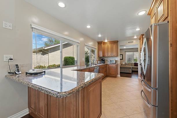 istock Modern kitchen with granite countertops and natural light. 2216337506