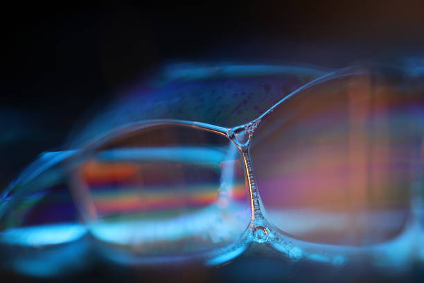 istock Blue reflections of liquid in macro, bright liquid surface on black background 2216343221