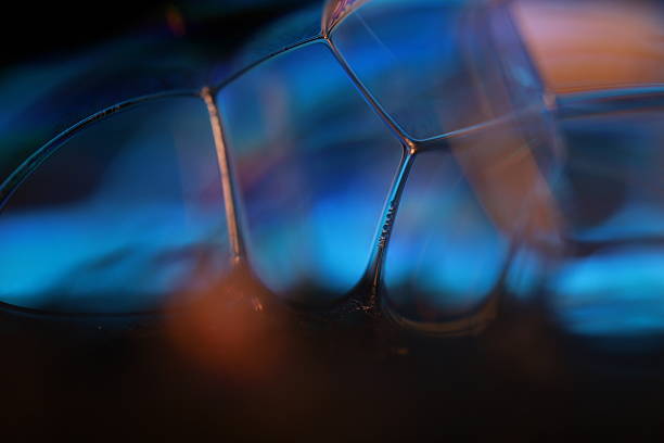 istock Black liquid lines, macro view, black cells, molecular connections, blue reflections 2216343241
