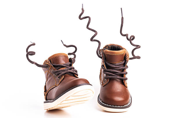 Baby shoes for a boy on a white background. Space for text.
