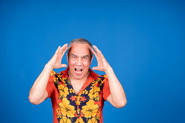 istock Stressed mature man screaming with hands on head 2216346021