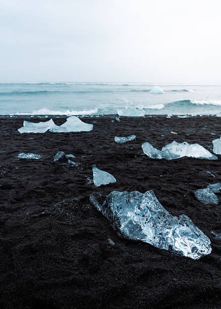 istock Diamond beach in Iceland with Ice Chunks on Black Sand and a Soft Magical Light 2216347876