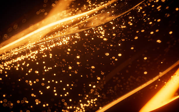 istock Golden glowing particles in glass geometry, 3d rendering. 2216349997