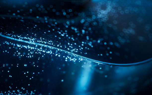 istock Blue glowing particles in glass geometry, 3d rendering. 2216350001