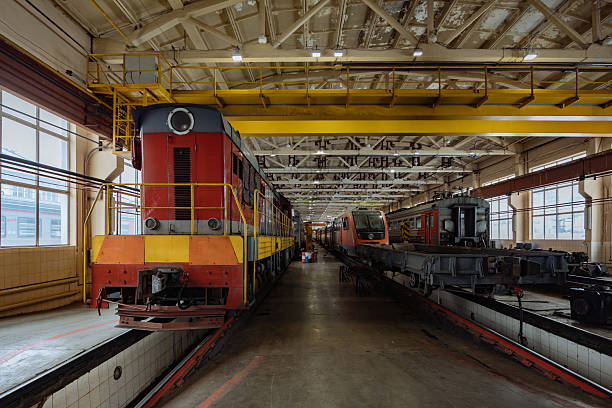 istock Trains at service in train repair workshop 2216350112