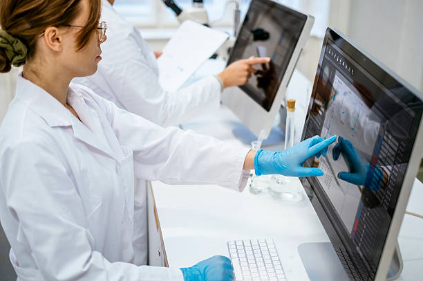 istock Young Caucasian Female Student Researching in Modern University Laboratory 2216352242