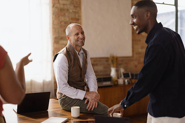 istock Creative business team discussing during informal office meeting 2216352610
