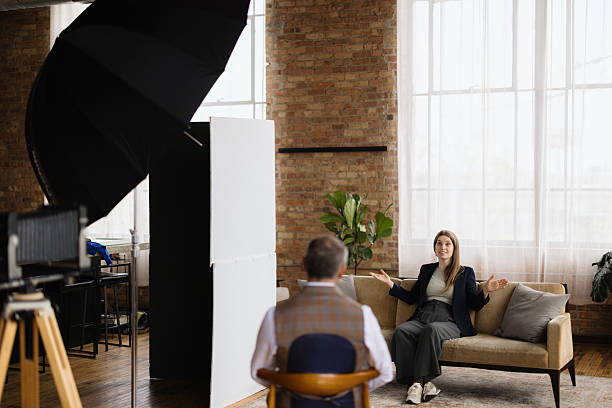 istock Businesswoman being interviewed in a loft studio setting, talking and gesturing 2216352705