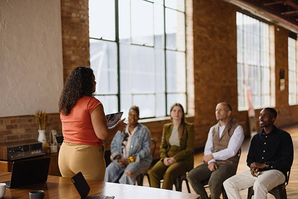 istock Confident businesswoman leading a presentation in a modern office 2216352753
