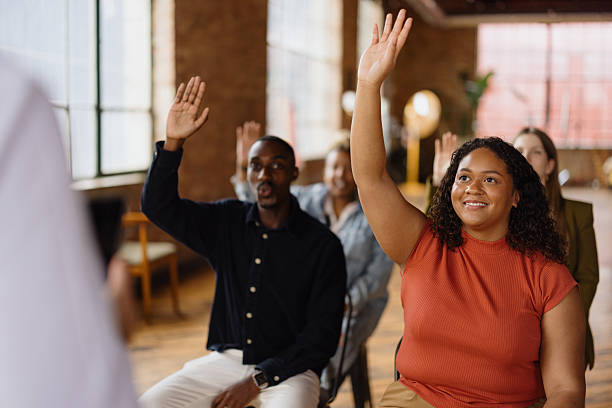 istock Students raising hands during a lesson in the classroom 2216352757