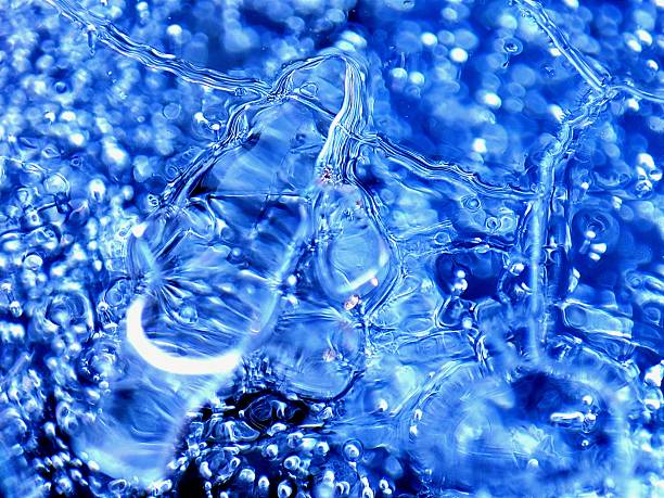 istock Bubbles frozen within the inside of a block of ice. 2216355368