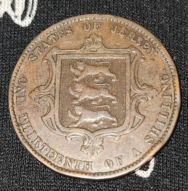 istock A Jersey, one thirteenth of a shilling coin. 2216355386