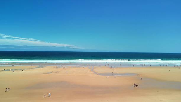 istock A Beautiful Beach with Clear Blue Sky and Gentle Waves Perfect for Relaxation and Fun 2216357704