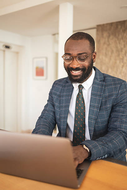istock Business professional working on a laptop in a modern office setting 2216361627