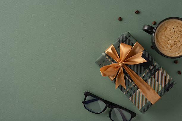 istock Flat lay composition featuring a gift box, eyeglasses, and coffee cup, evoking themes of gratitude and celebration 2216361792