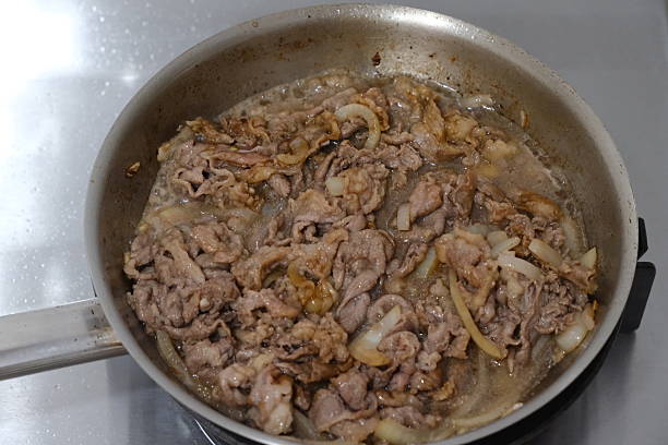 istock Slice beef with teriyaki sauce on frying pan 2216362829