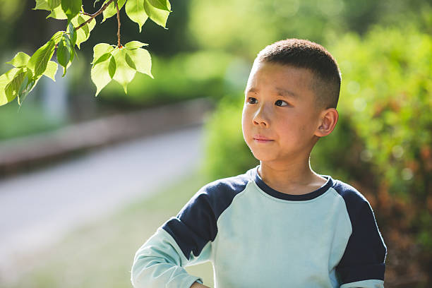 istock Cute child having fun in the nature. 2216365781