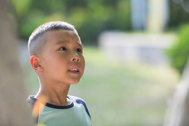 istock Little asian boy playing in the park. 2216365797