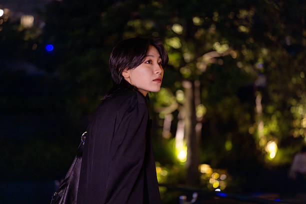 Young female freelance worker going back home at night