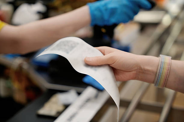 istock Grocery Receipt Exchange at Checkout Counter 2216369016