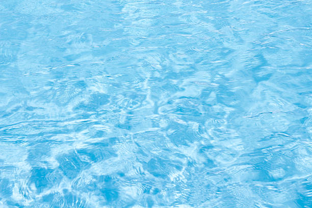 istock Abstract water wave ripple in swimming pool light blue background 2216370603